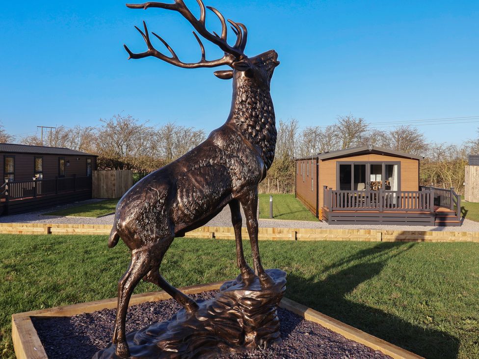 A stag statue in front of a holiday home at Meadows Park 2 Great Hatfield near Hornsea