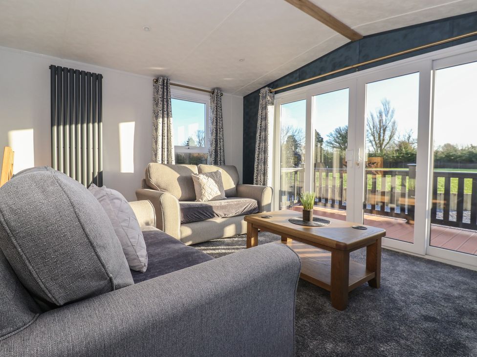 A living room with sofas and a coffee table at Meadows Park 2 Great Hatfield near Hornsea