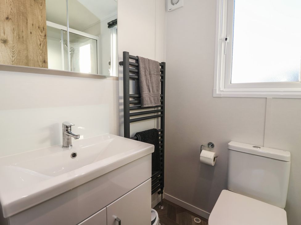 A bathroom with sink and toilet at Meadows Park 2 Great Hatfield near Hornsea