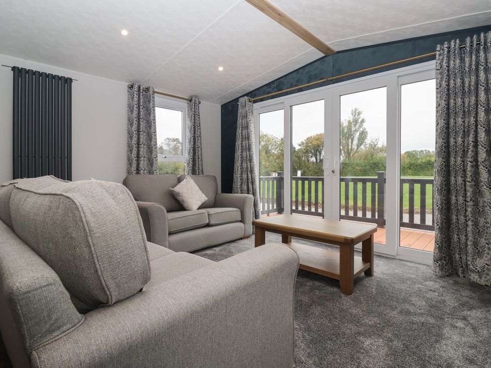 A living room with a sofa and coffee table at Meadows Park 3 Great Hatfield near Hornsea