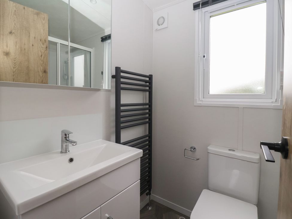 A bathroom with a sink and toilet at Meadows Park 3 Great Hatfield near Hornsea