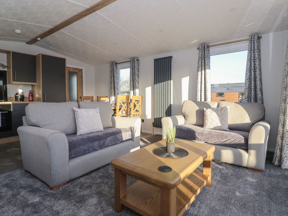 A living room with a sofa and coffee table at Meadows Park 3 Great Hatfield near Hornsea