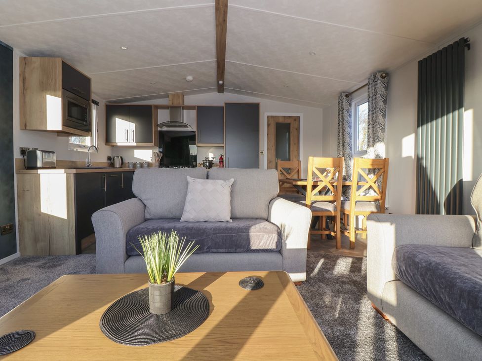 A living room with sofa and dining table at Meadows Park 3 Great Hatfield near Hornsea