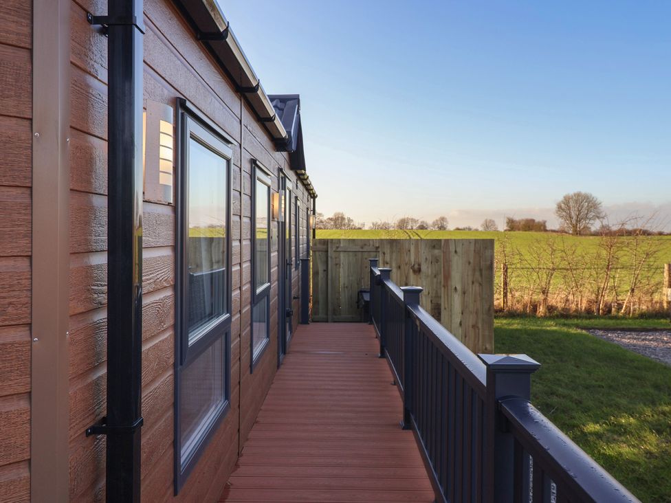 Outdoor photo of a wooden decking and fence at Meadows Park 5 Great Hatfield near Hornsea