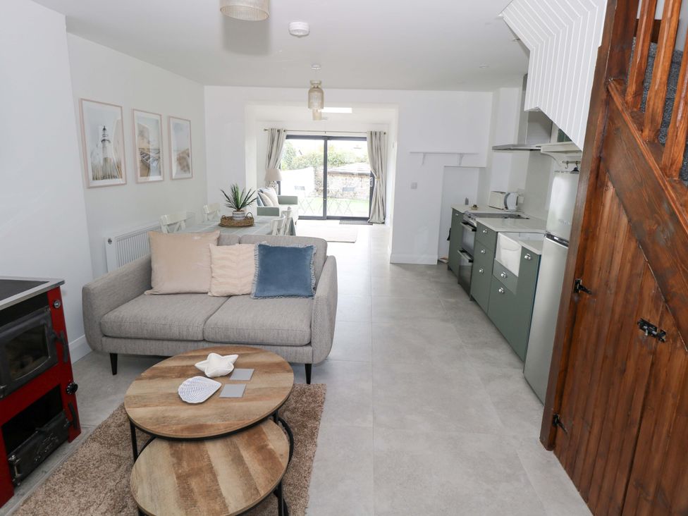 A living room with a sofa and coffee table at Rose Cottage in Killala, County Mayo