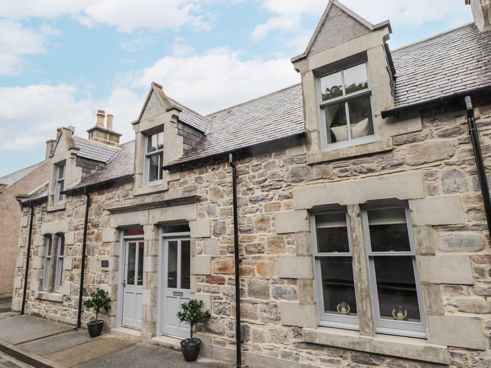An exterior view of a stone cottage at Apple Tree Cottage in Cullen