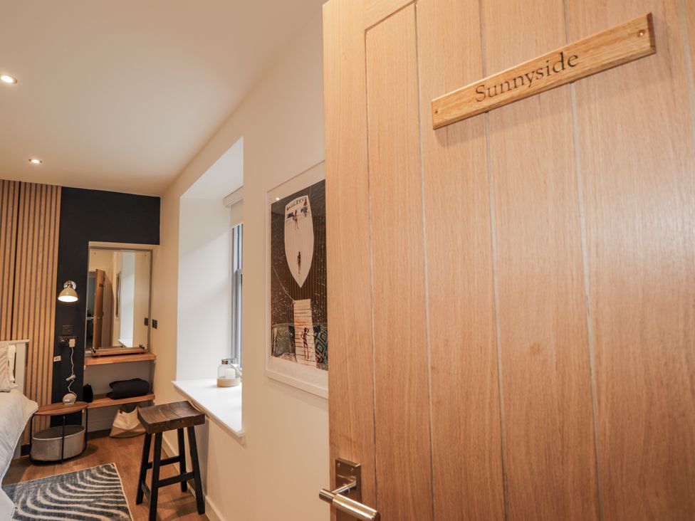 A bedroom with a bed and lamp at Apple Tree Cottage in Cullen