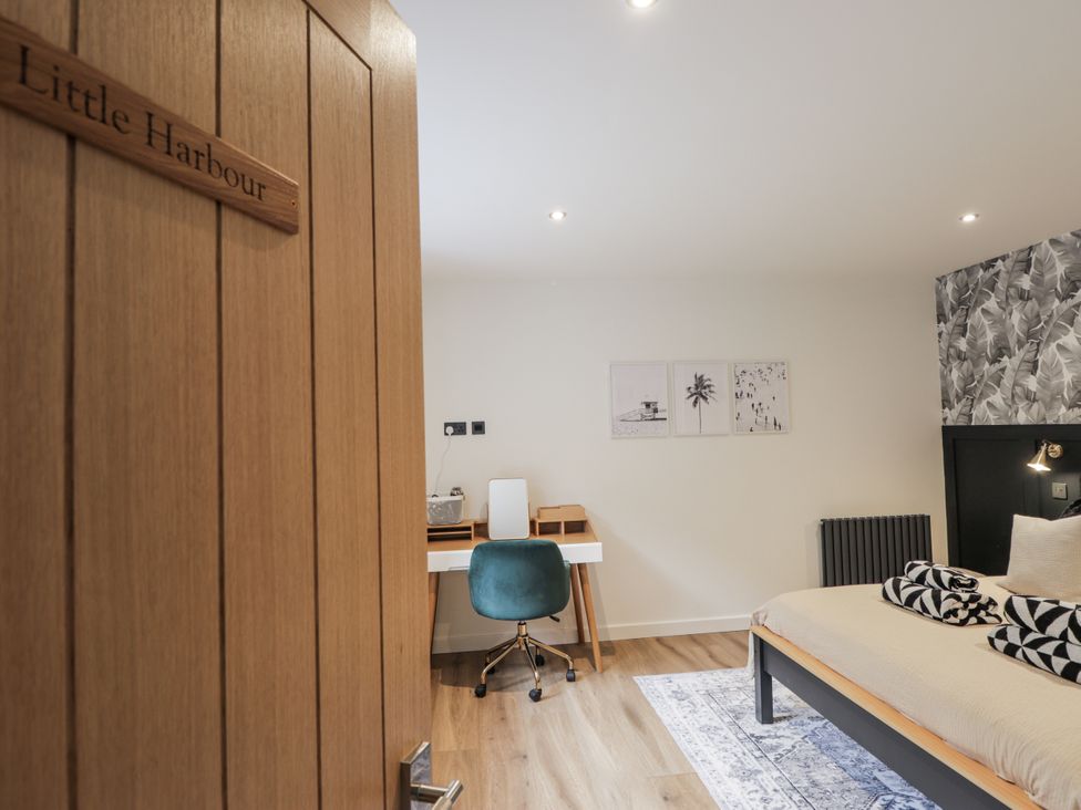 A bedroom with a desk and chair at Apple Tree Cottage in Cullen
