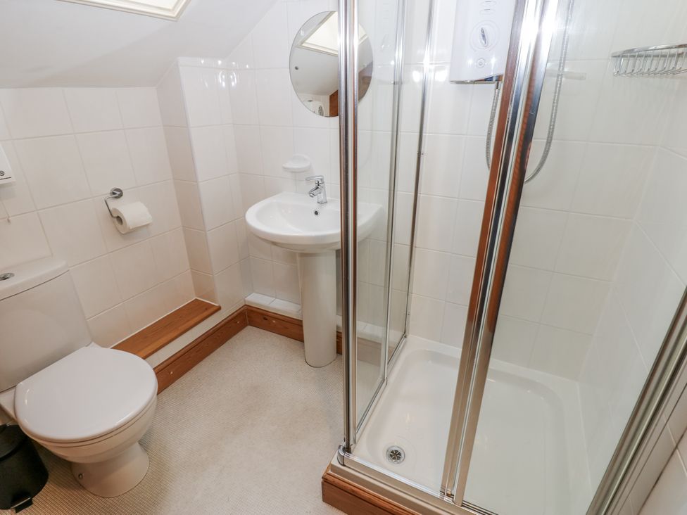 A bathroom with a shower and sink at 1 Mill Cottage (known as Old Mill 1) Askrigg near West Burton
