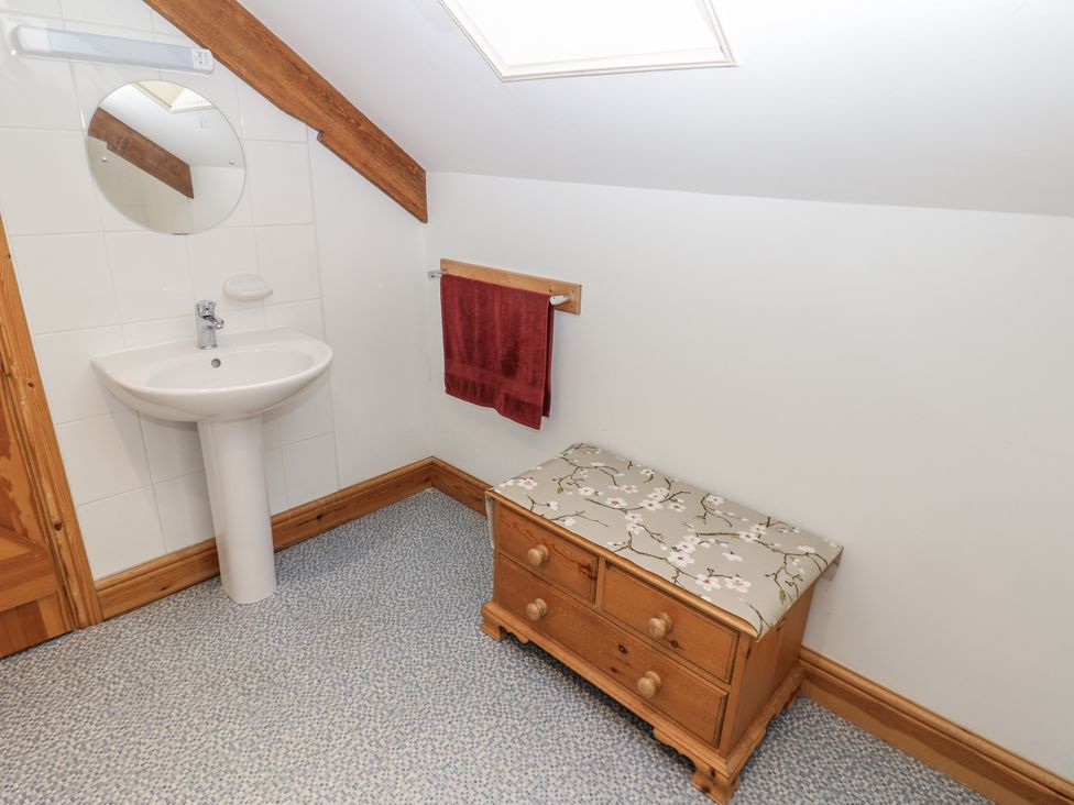 A bathroom with a sink and mirror at 1 Mill Cottage (known as Old Mill 1) Askrigg near West Burton