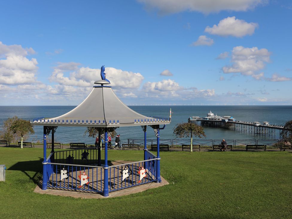 A bandstand with a view of the pier at Mariners Lee in Llandudno