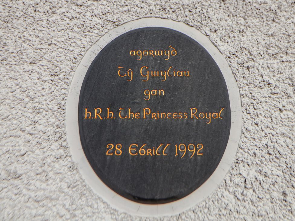 A plaque indicating opening by H.R.H. The Princess Royal at Clwyd Special Riding Centre