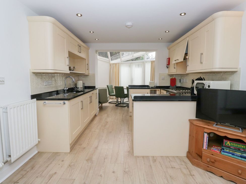 A kitchen with cabinets and appliances at Swirl Howe in Keswick