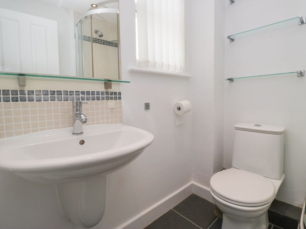 A bathroom with a sink and toilet at Swirl Howe in Keswick