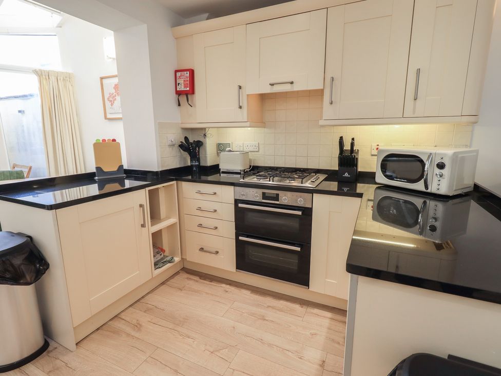 A kitchen with an oven and microwave at Swirl Howe in Keswick