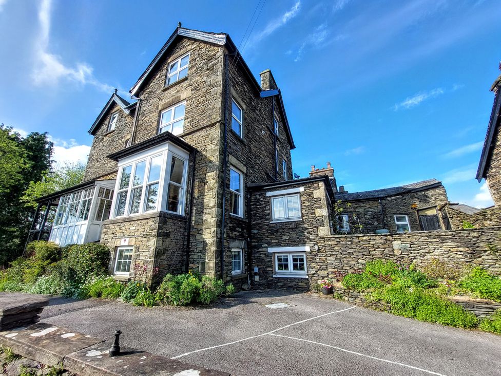A stone house with a garden at 1 Park Road Windermere