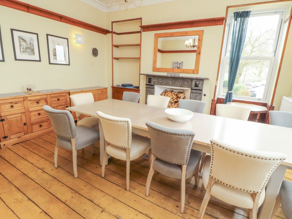 A dining room with a large table and chairs at 1 Park Road in Windermere