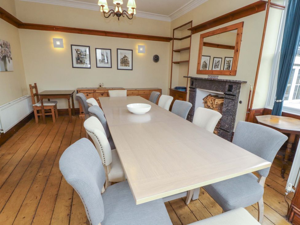 A dining room with a large table and chairs at 1 Park Road in Windermere
