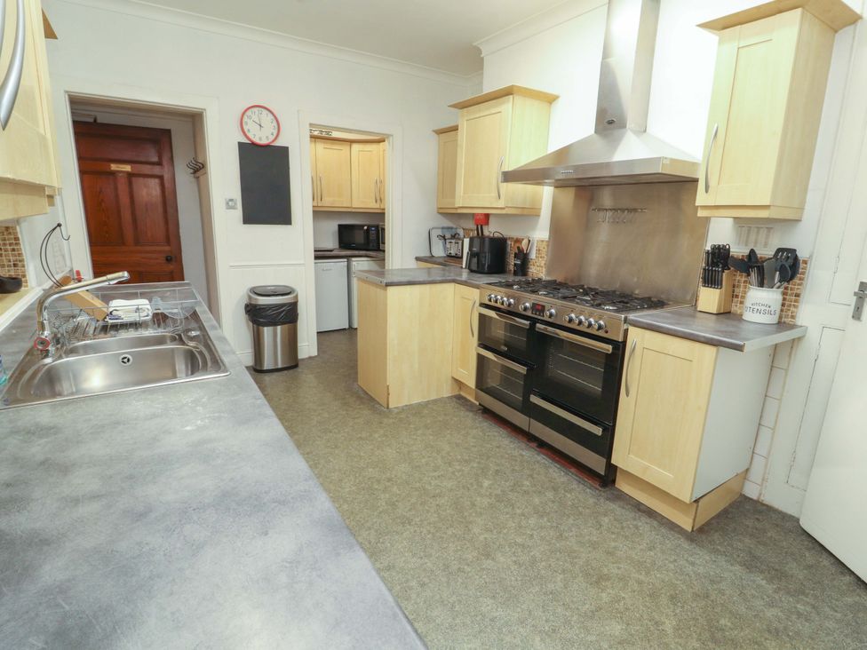 A kitchen with cabinets and appliances at 1 Park Road in Windermere
