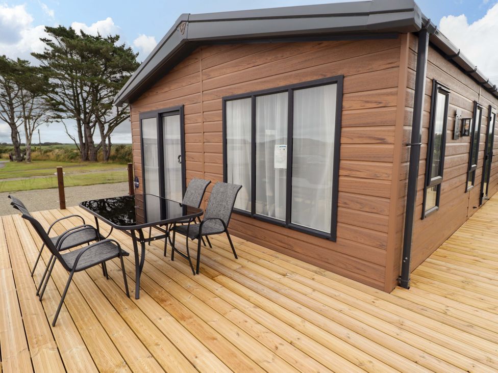 An outdoor area with a table and chairs at Dolphin in Haverfordwest