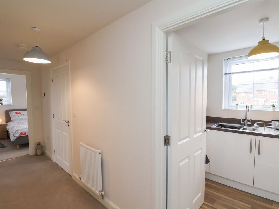 A kitchen area with a sink and window at Larpool Retreat
