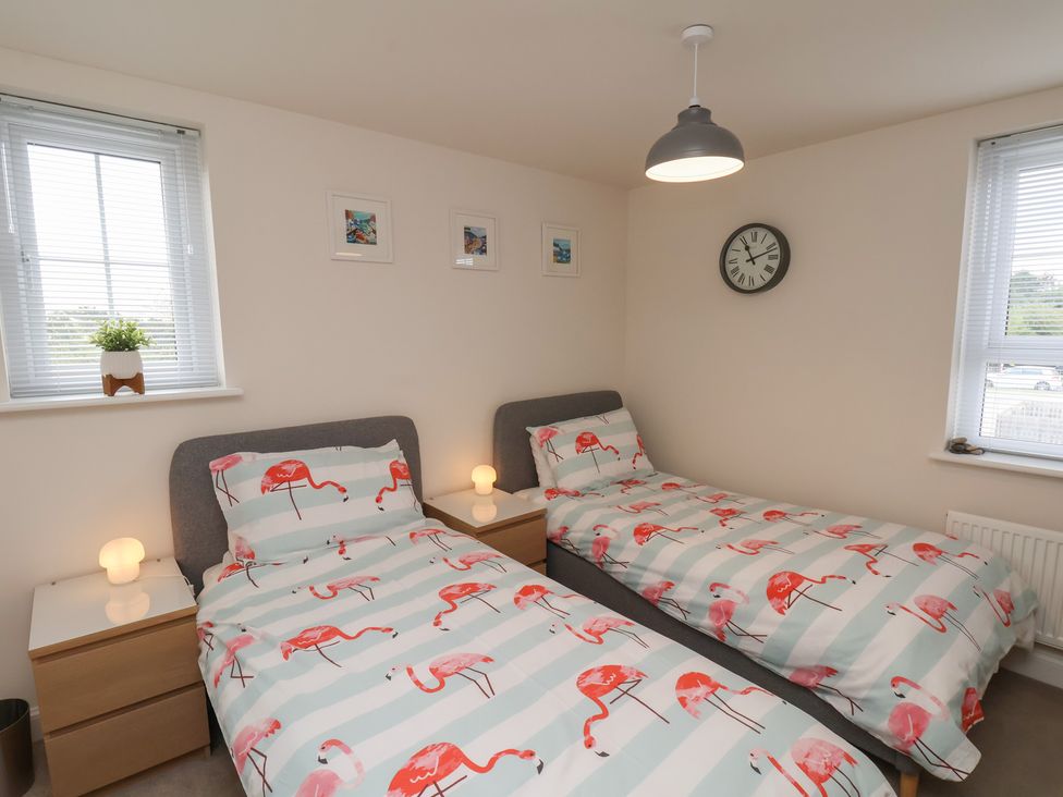 A bedroom with two single beds at Larpool Retreat