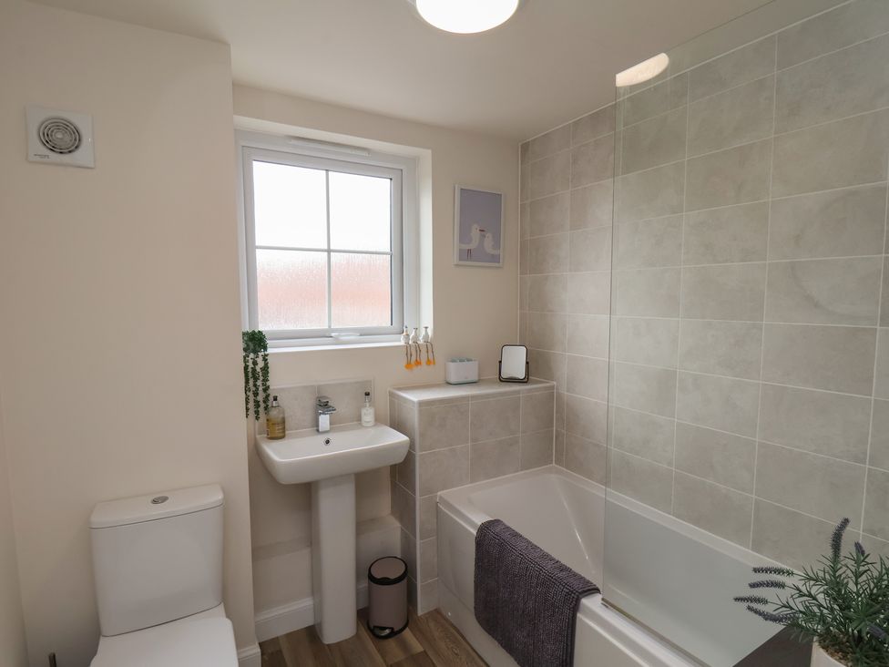 A bathroom with a sink and bathtub at Larpool Retreat