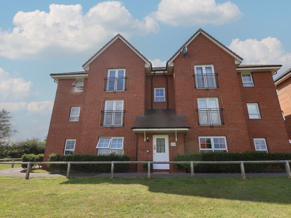A multi-story brick building with balconies at Larpool Retreat 