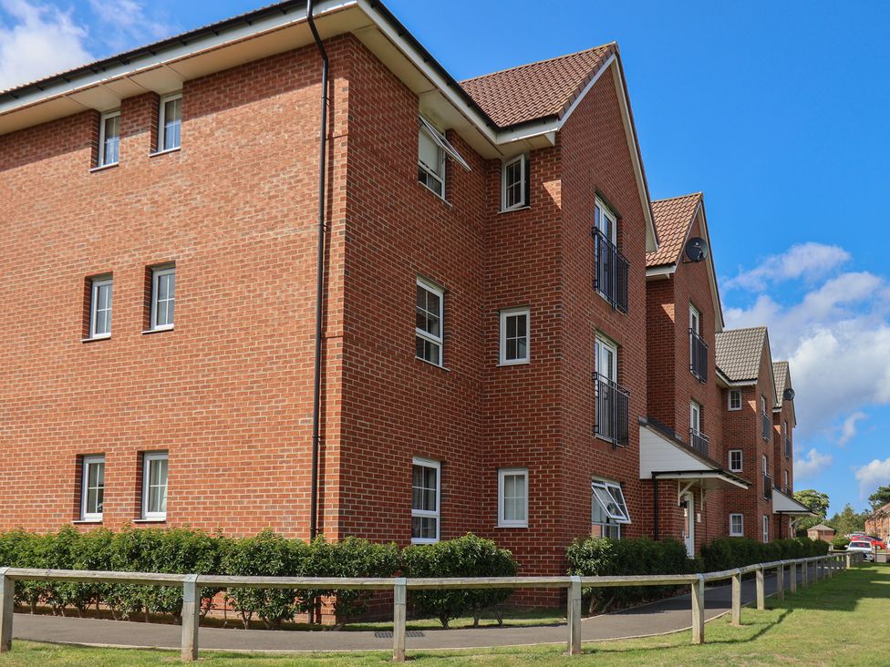 A brick building with windows and balconies at Larpool Retreat