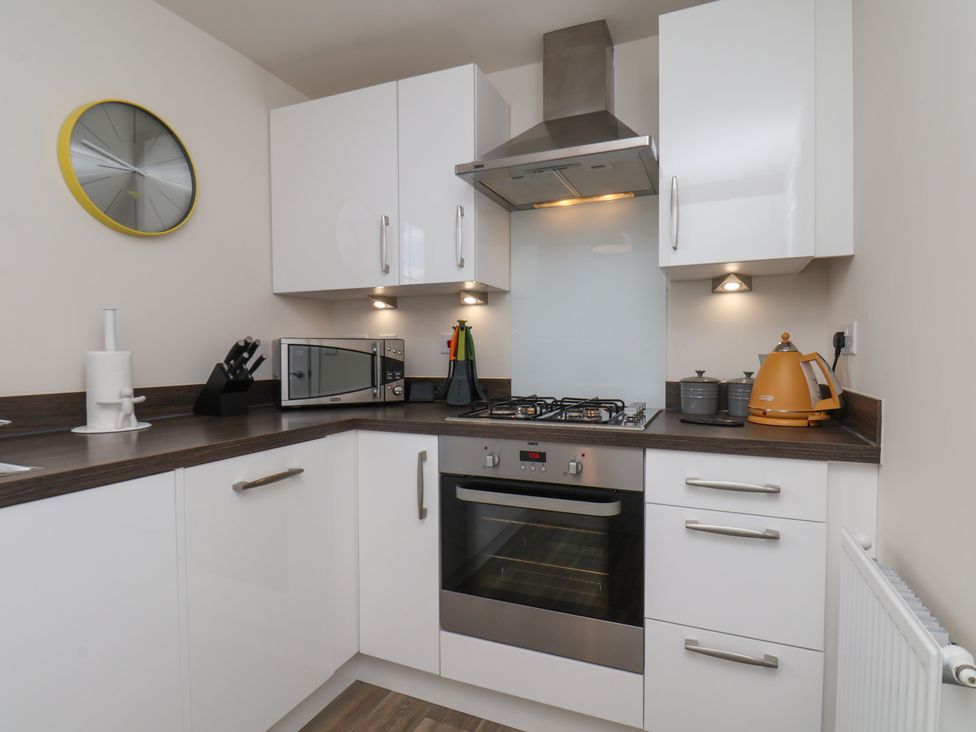 A kitchen with modern appliances and counter space at Larpool Retreat in Whitby