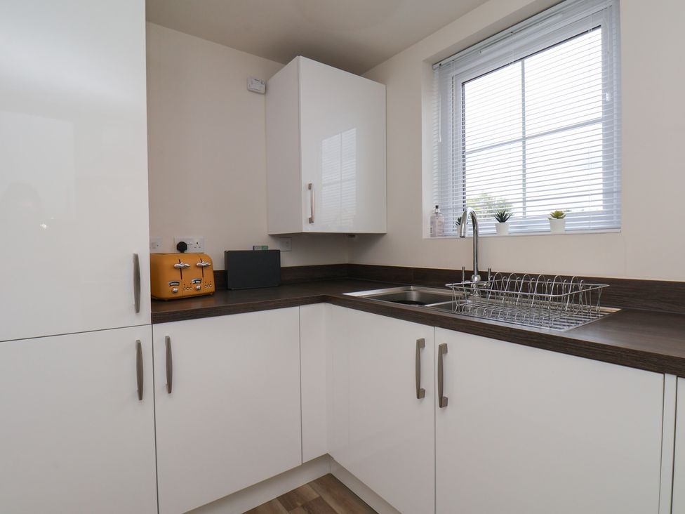A kitchen with a sink and toaster at Larpool Retreat in Whitby