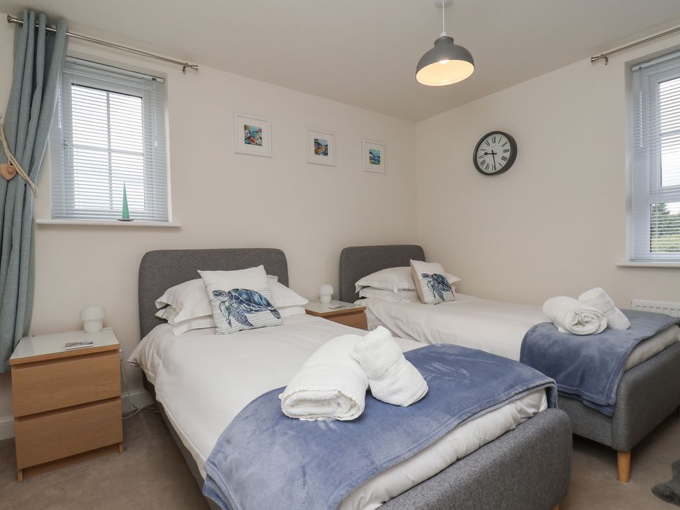 A bedroom with two single beds at Larpool Retreat in Whitby