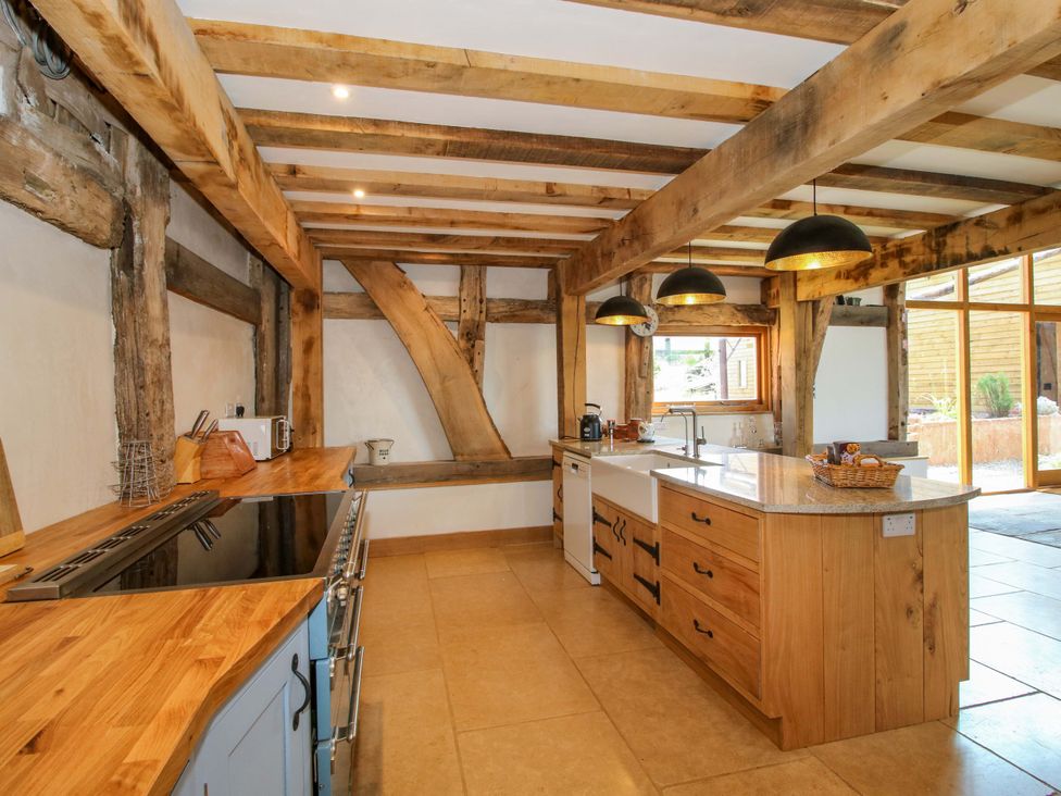 A kitchen with wooden countertops and cabinets at Crook Barn in Tenbury Wells