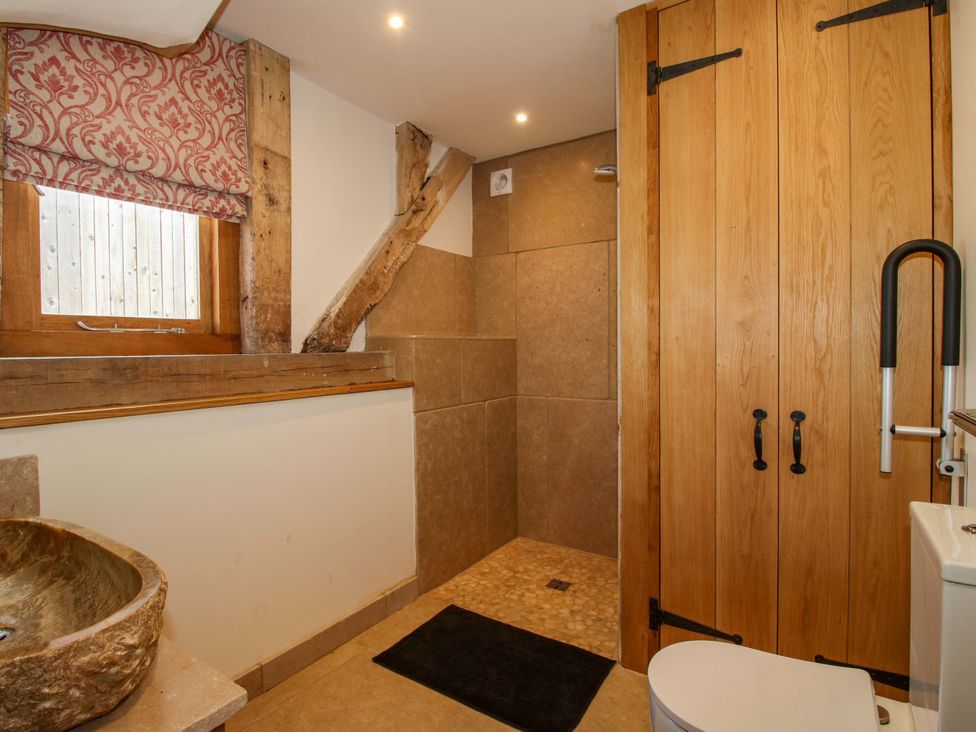 A bathroom with a shower and a sink at Crook Barn in Tenbury Wells