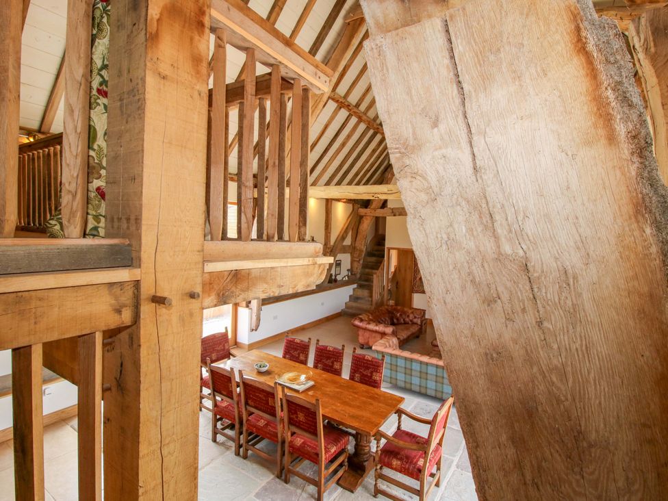 A dining area with a table and chairs at Crook Barn Tenbury Wells