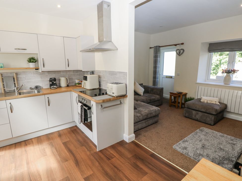A kitchen with a stove and sink at Vern Dale in Builth Wells