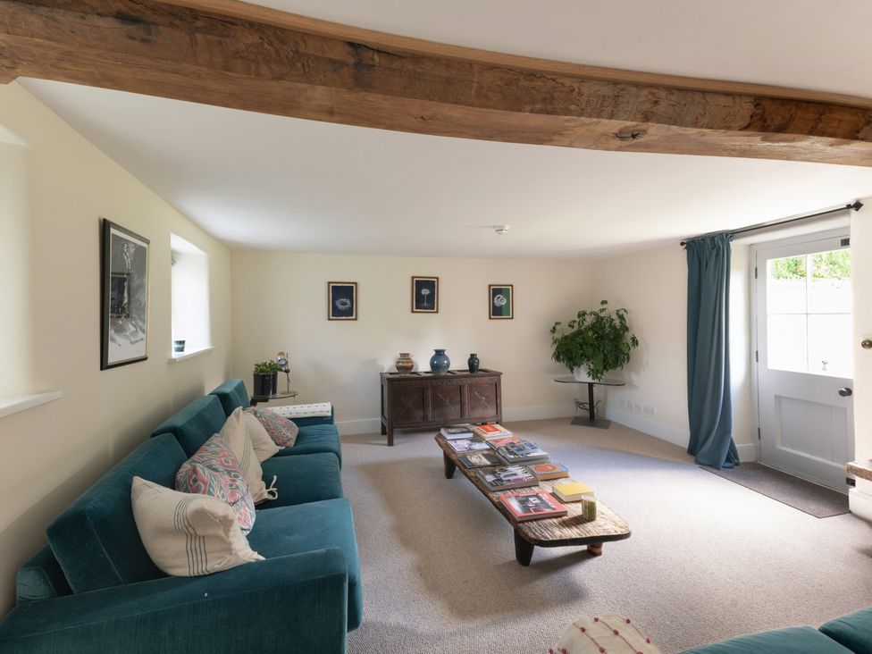 A living room with a sofa and coffee table at West Cottage Llandovery