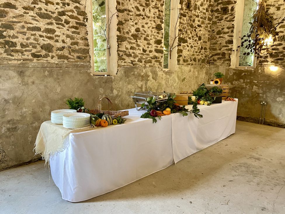A dining room with a table set for food at West Cottage in Myddfai near Llandovery