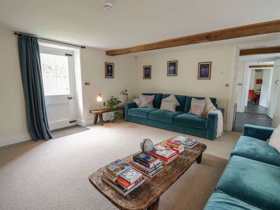 A living room with a sofa and coffee table at West Cottage in Myddfai near Llandovery