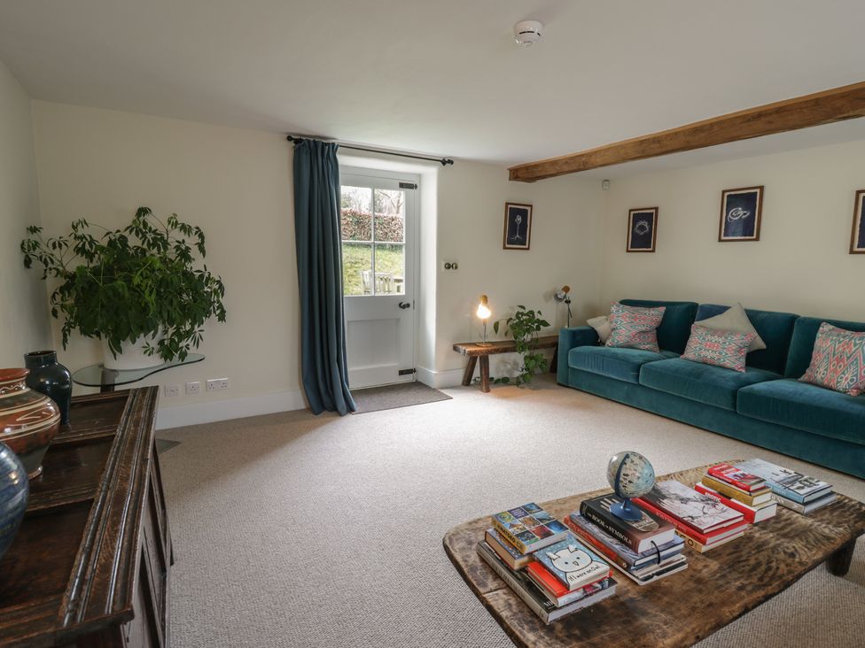 A living room with a sofa and coffee table at West Cottage in Myddfai near Llandovery