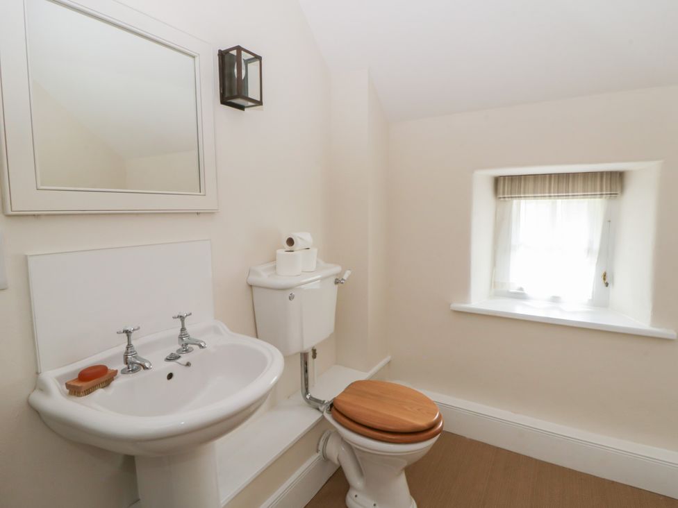 A bathroom with a sink and toilet at Gatekeepers Cottage Myddfai near Llandovery