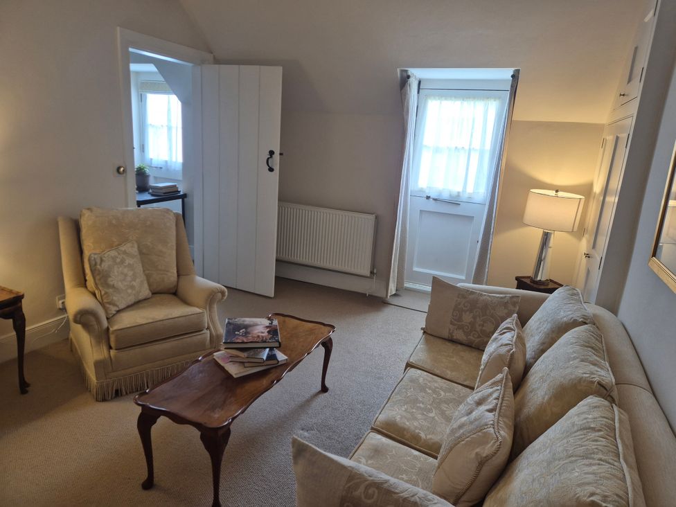 A living room with sofa and armchair at Gatekeepers Cottage Myddfai near Llandovery
