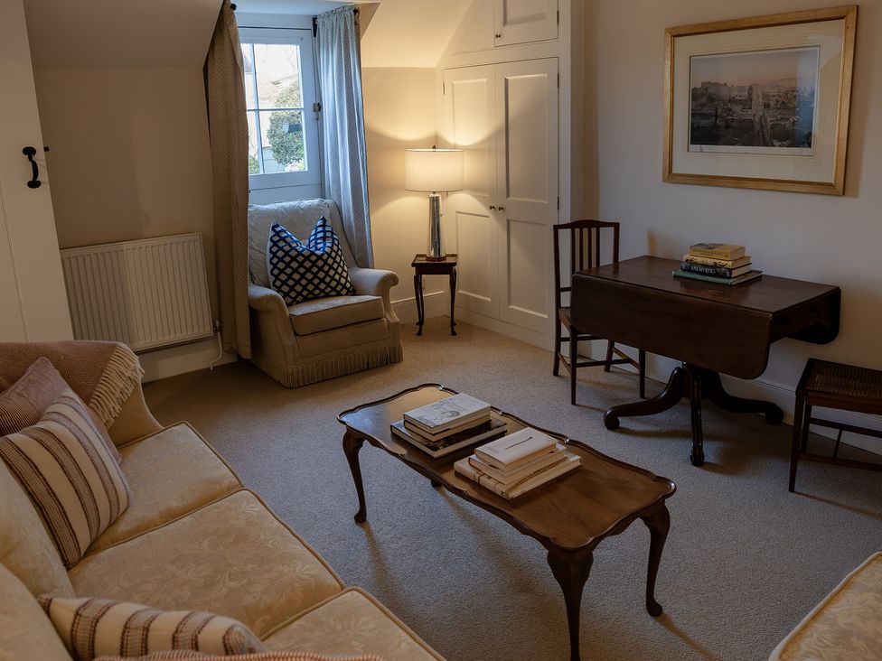 A living room with a sofa chair and table at Gatekeepers Cottage Myddfai near Llandovery