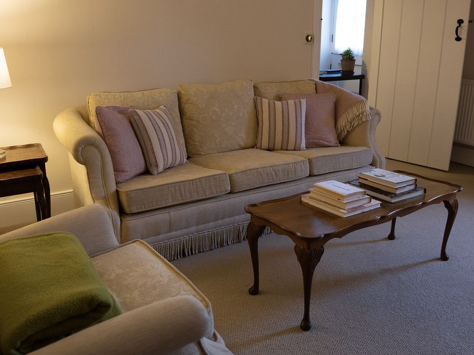 A living room with a sofa and coffee table at Gatekeepers Cottage Myddfai near Llandovery