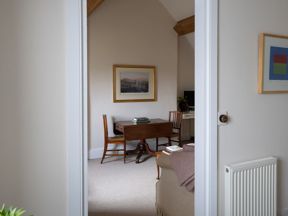 A study with a desk and chair at Gatekeepers Cottage in Myddfai near Llandovery