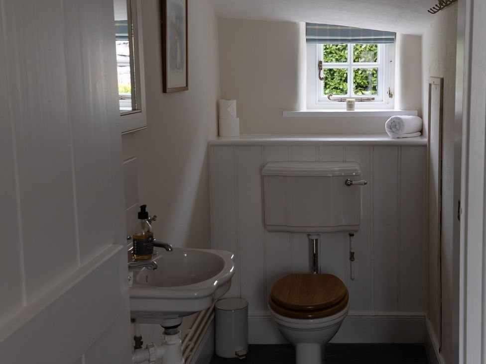 A bathroom with a sink and toilet at Gatekeepers Cottage Myddfai near Llandovery