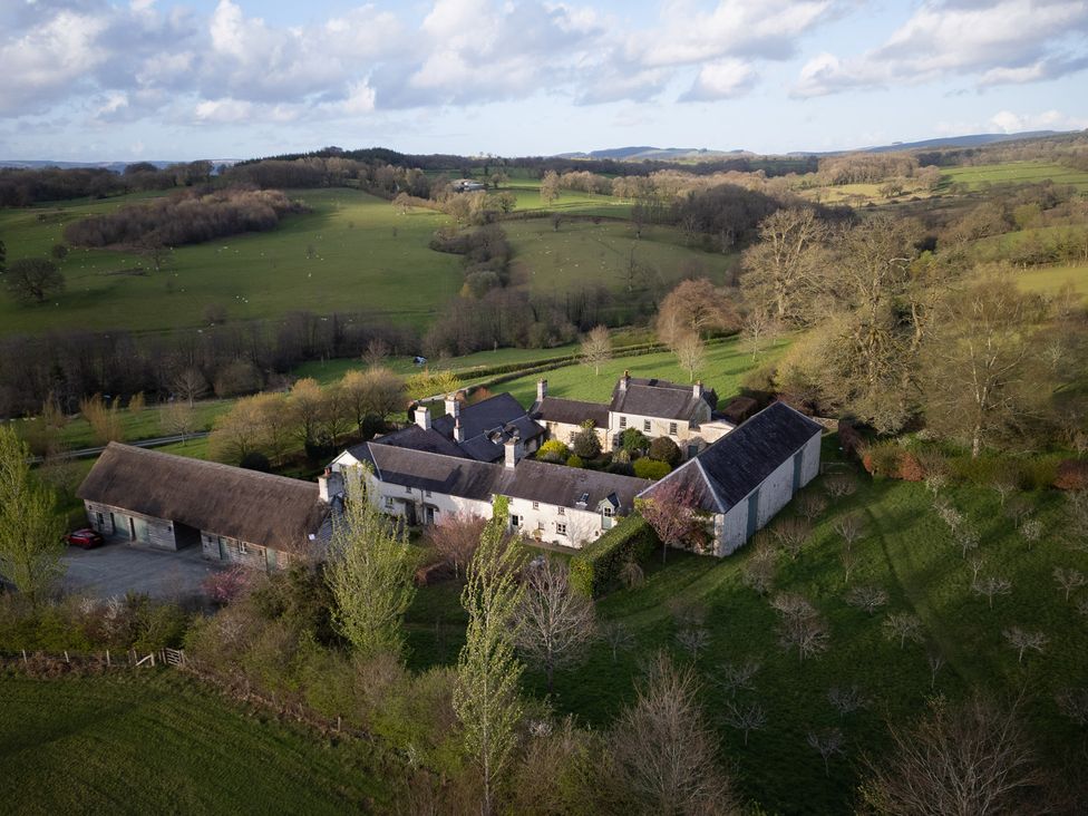 A view of a cottage surrounded by fields at Gatekeepers Cottage in Myddfai near Llandovery