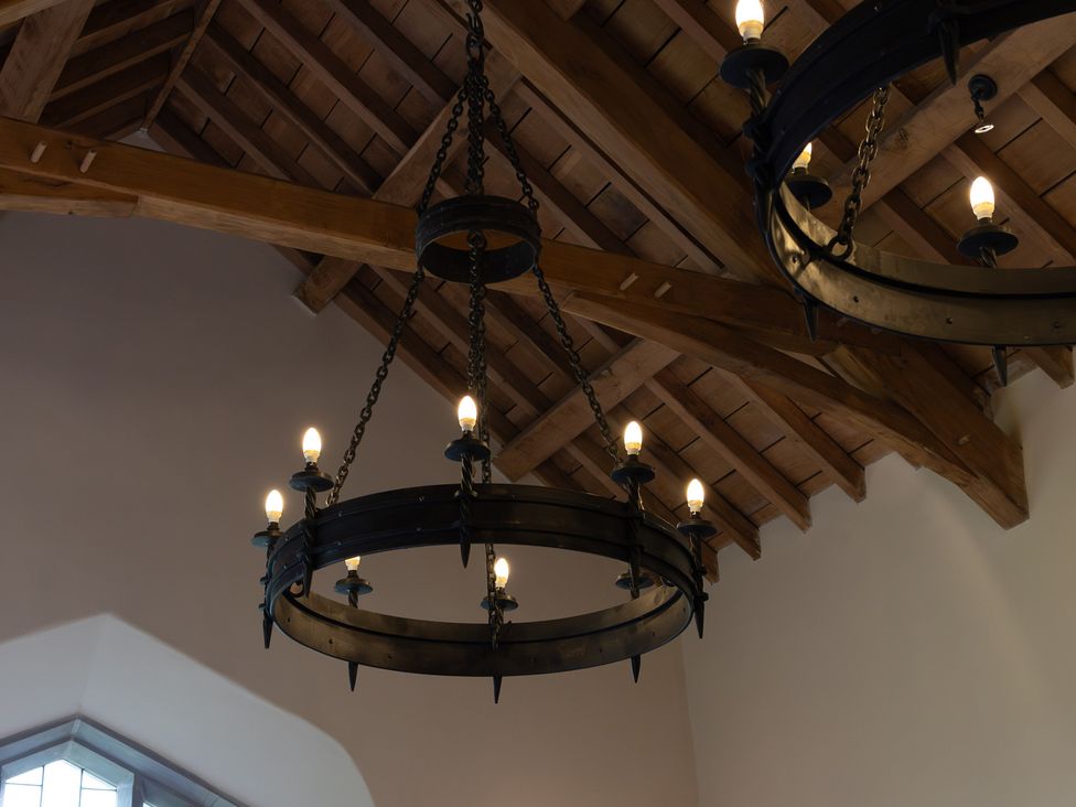 A ceiling with two chandeliers at Gatekeepers Cottage Myddfai near Llandovery