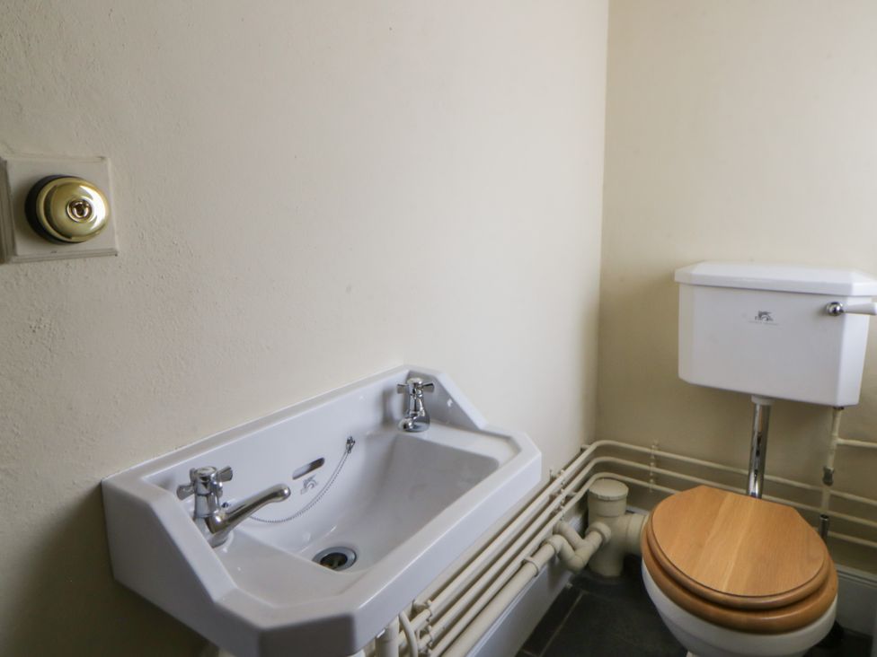 A bathroom with a sink and a toilet at North Cottage in Llandovery