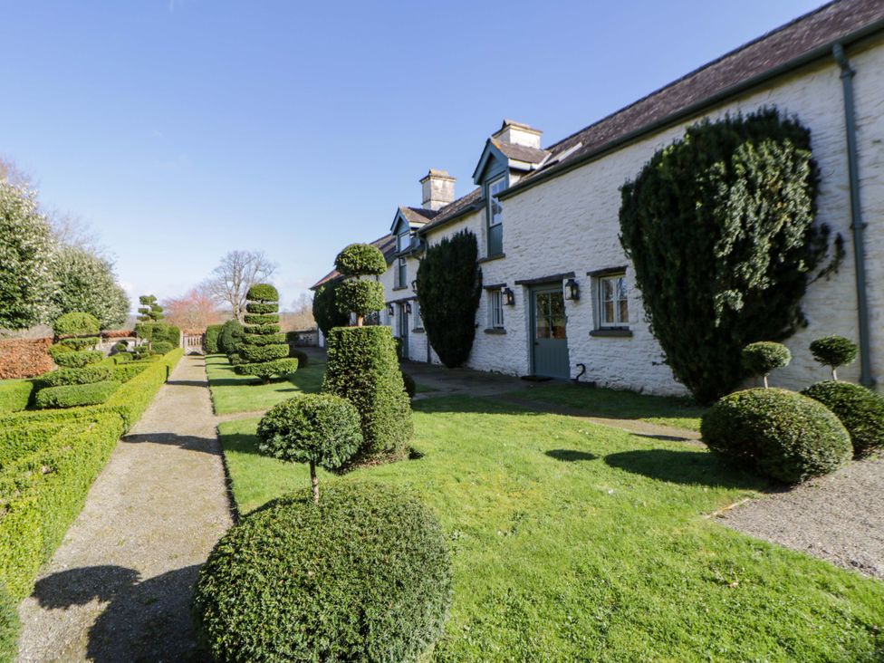 A house with landscaped gardens and topiary at North Cottage Myddfai near Llandovery